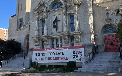 A banner emblazoned with the words “It’s Not Too Late To Fix This Mistake” hung at the Greater Birmingham Ministries