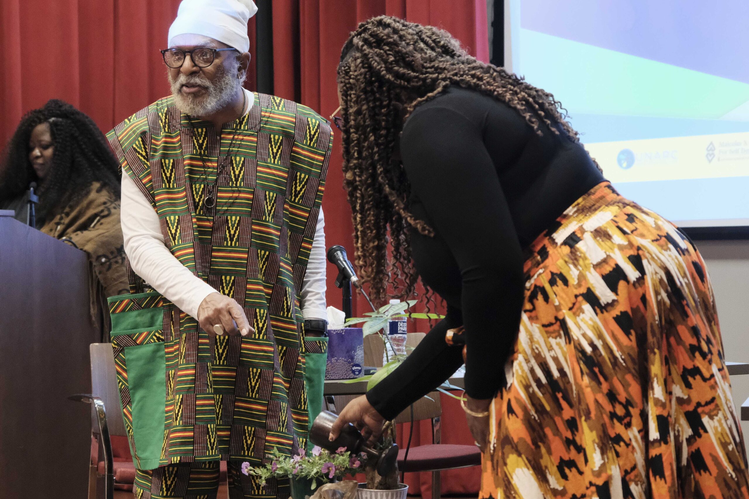 Tiffany Williams Roberts pours a libation to open the UN EMLER Convening.